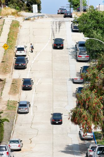 John MacLean Two and Twoblack car drives up a steep street to top of hill in San Diego colorful trees on right woman walks to white car. artwork by John MacLean London based photographer