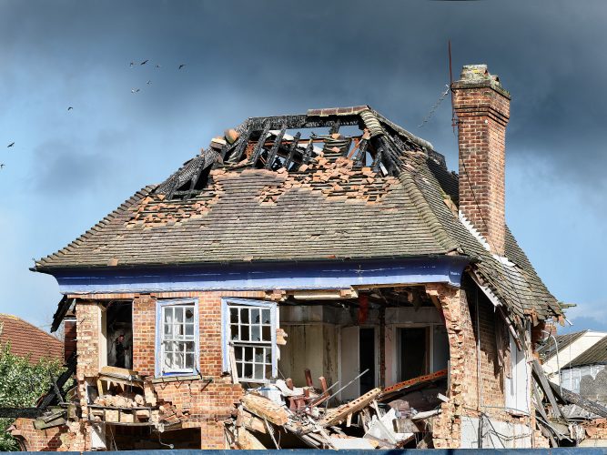 John MacLean Hometownsa partially destroyed suburban house with fire damage in London UK art photography by John MacLean