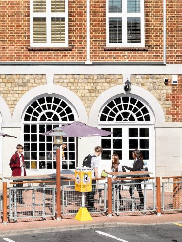 John MacLean Systemdetail of Grandiose McDonald’s restaurant in a converted period building at Elstree Borehamwood London kids eating in foreground