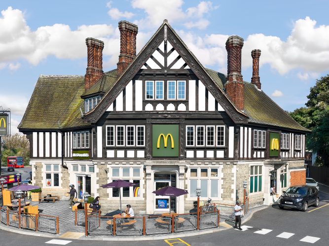 John MacLean SystemAn old English Tudorbethan pub converted into a McDonald’s restaurant in Southall, London. The manager is sitting outside in the sun having lunch, while customers walk across a zebra crossing as they arrive and leave the restaurant